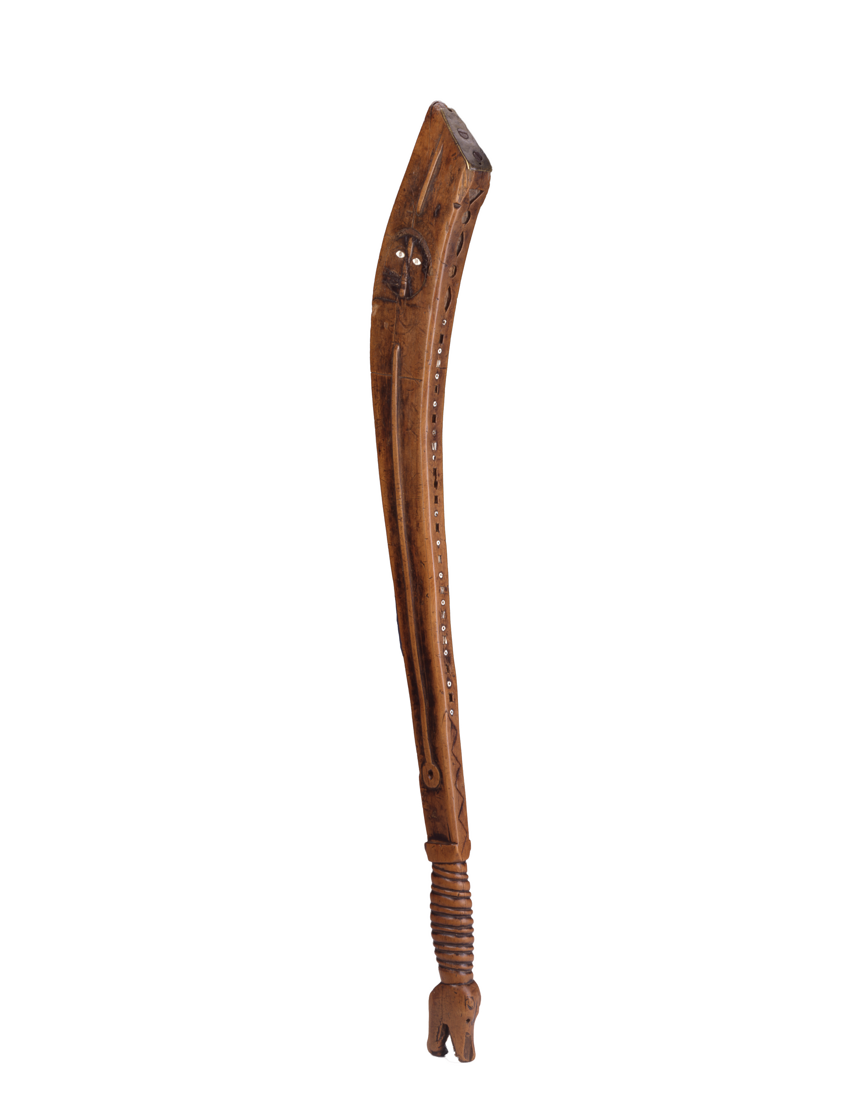 A 17th century, 24 inch long, wooden war club featuring a wood coiled handle grip at the base and the face of a Native American warrior with piercing white eyes at the upper end of the shaft.