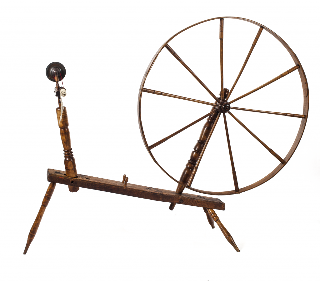 A wooden spinning wheel with the bobbin and maidens on the left and the large drive wheel on the right.