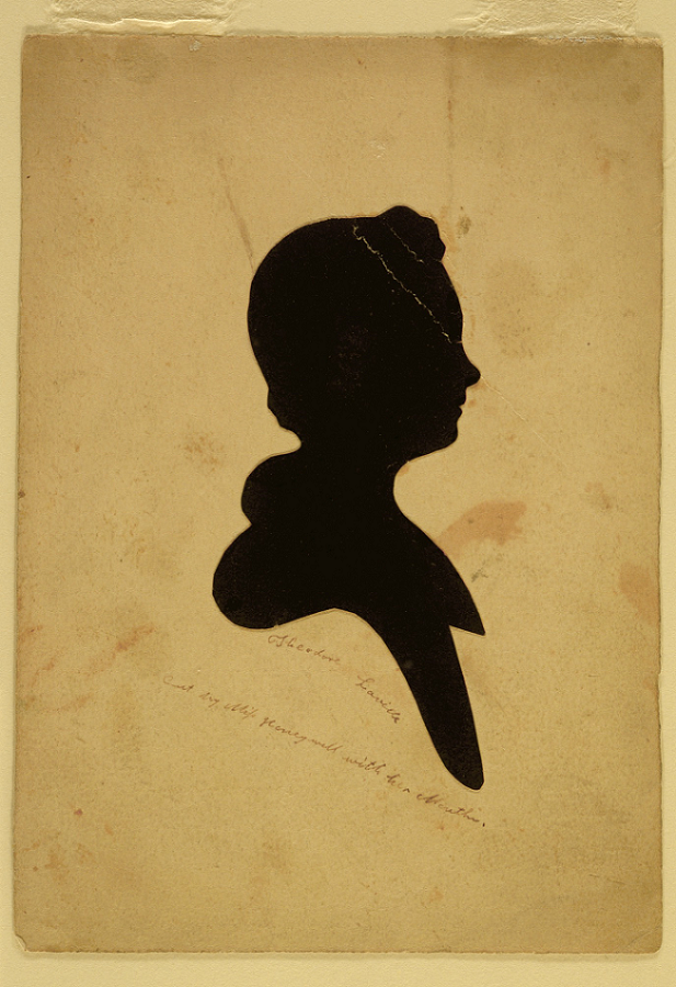 Circa 1830 silhouette profile portrait looking to the right of a young male, inscribed below as Theodore Laveille and cut by Martha Honeywell. 